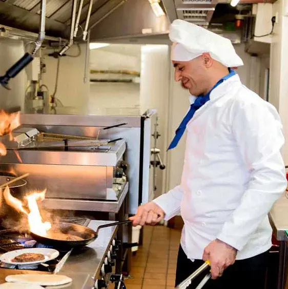 Capitol Ridge Chef Created Meals, chef frying a dish.