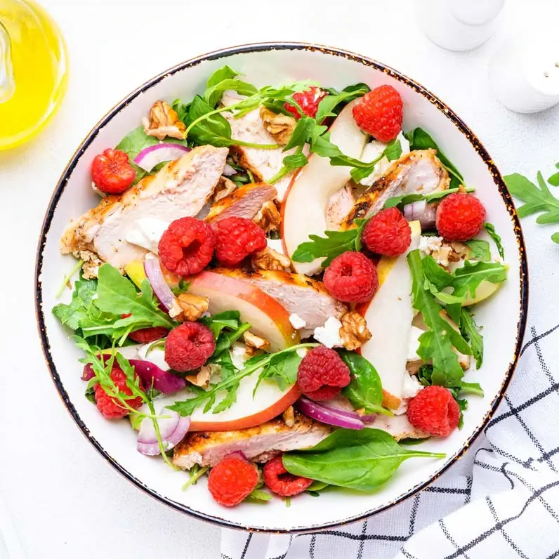 A chicken salad with fruit