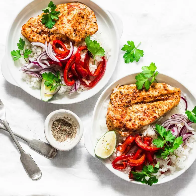 A chicken and vegetable meal for two