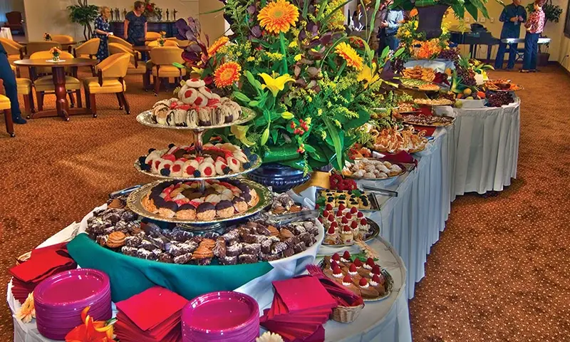 A holiday buffet table covered in sweet treats