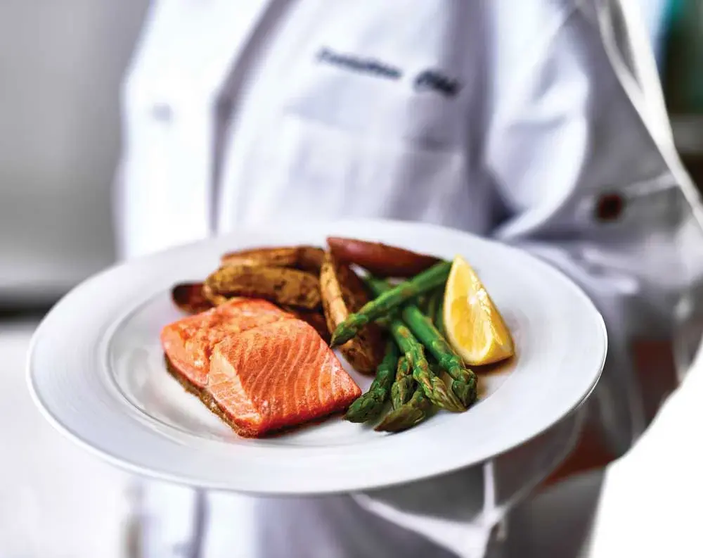 Hawthorn Senior Living Culinary Services, Chef Holding A Dinner Plate